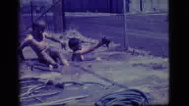 Ely Nevada (1968): Two Boys Playing In A Mud Hole