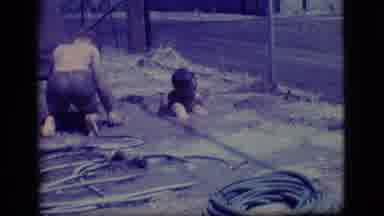 Ely Nevada (1968): Two Children Filling A Hole With Water And One Child Has