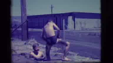 Ely Nevada (1968): Two Boys Playing Outside In A Self-Made Mud Pit Filled With