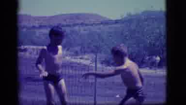 Ely Nevada (1968): Two Little Boys Playing In A Self Made Mud Pit Filled With