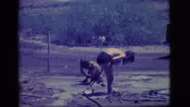 Ely Nevada (1968): Two Kids Playing In A Puddle Near A Road