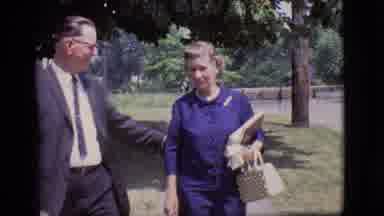 Des Moines Iowa (1966): Man And Woman Walking On The Street As The Man Holds Her