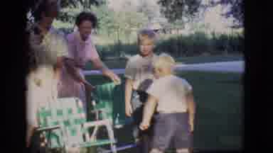 Des Moines Iowa (1966): Two Boys Are Sitting Outside In Law Chairs And They Stand