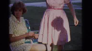 Des Moines Iowa-1966: Two Women And A Boy Enjoying The Sunshine And Relaxing At
