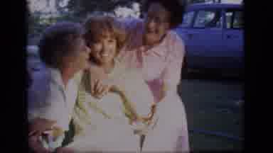 Des Moines Iowa (1966): A Young Woman Sits In A Front Yard As Two Older Woman Come