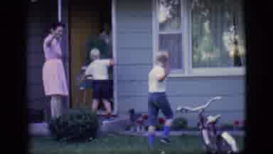 Des Moines Iowa (1966): Four People Walk Into A House While Turning Towards The