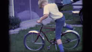 Des Moines Iowa (1966): Kid Hopping On His Bicycle Getting Ready To Ride It