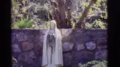 SAN LUIS COLORADO-1965: Mother Mary Statue And Woman At Stone Chapel