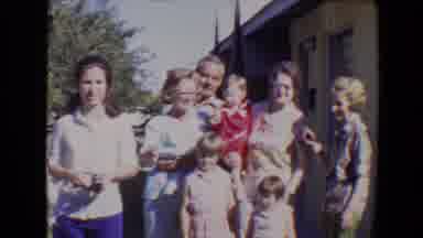 Evansville Indiana USA (1967): A Family Standing In A Group Waiting For A Group