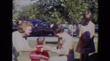 Evansville Indiana USA (1967): Two Ladies Outside On The Grass With A Baby In A