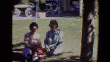 Evansville Indiana USA (1967): Sweeping View Of A Family Seated In The Grass On A