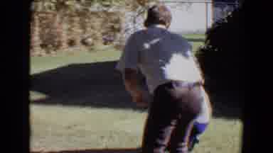 Evansville Indiana USA (1967): Man Wearing White Shirt Gives Camera To Woman