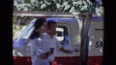 Evansville Indiana USA (1967): Man And Woman Standing Outside Of A Work Vehicle