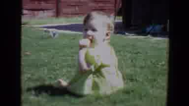 Evansville Indiana USA (1967): Baby Crawling On Grass While Dog Plays Behind Her