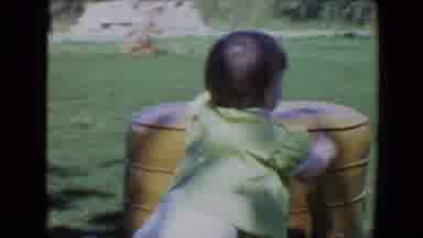 Evansville Indiana USA (1967): Young Child Getting Up Outside During The Summer By
