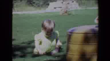Evansville Indiana USA (1967): A Little Baby Playing Outside And Crawling All Over