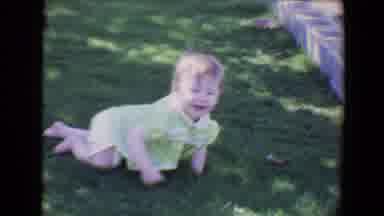 Evansville Indiana USA (1967): Baby Crawling On Grass Towards The Concrete Blocks