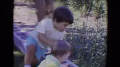Evansville Indiana USA (1967): Children Playing On Cinder Blocks In Yard
