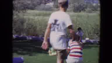 Evansville Indiana USA (1967): People Sitting And Watching Something In The Grass