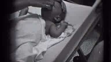 Trenton New Jersey-1941: Parent Cleaning Baby's Face With Towel