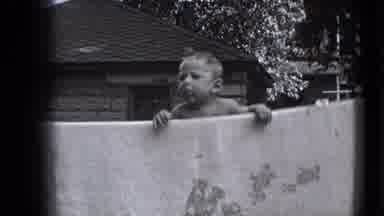 Trenton New Jersey (1941): Baby In Black And White Hanging Over A Washing Line