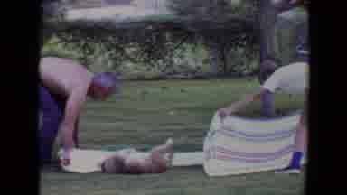 Flagstaff Arizona-1961: A Man And A Boy Wrap A Dog In A Towel In The Yard