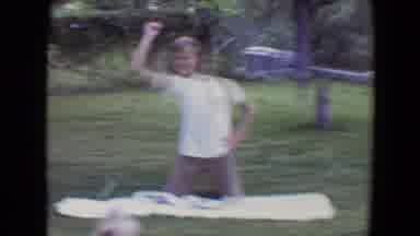 Flagstaff Arizona (1961): Boy Wearing Tan Shorts Throws Object To Tan Dog On A