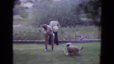 Flagstaff Arizona (1961): A Boy Playing Football With His Dog And A Man Doing Some