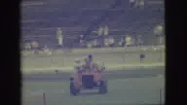 Denver Colorado (1949): Three Men Riding In An Old-Time Car In Front Of A