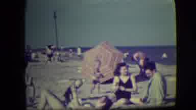Asbury Park New Jersey (1946): A Happy Family Sitting On The Beach Area Full And