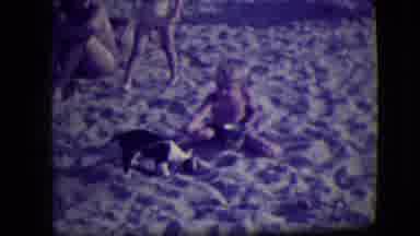 Asbury Park New Jersey (1946): Boy Points At Black And White Dog Digging In Sand
