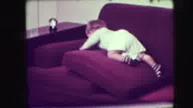 Union City New Jersey (1942): Baby Playing On Sofa While Crawling On Sofa