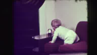 Union City New Jersey (1942): Baby Plays With Clock Then Sits On The Back Of The