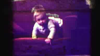 Union City New Jersey (1942): Baby Wearing White Sweater Reaches Out To Floor From