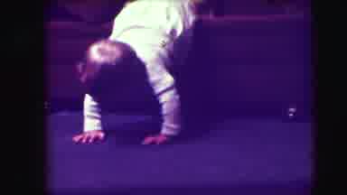 UNION CITY NEW JERSEY-1942: Baby Crawls On Purple Carpet In Living Room