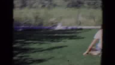 Davis California (1967): Family Relaxing On A Grass During The Afternoon While