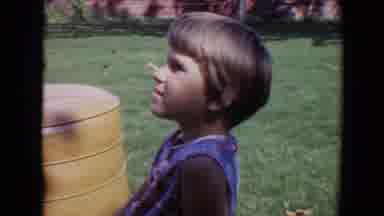 Davis California (1967): Person Wearing Blue Shirt Sits Next To Yellow Cushion On