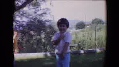 Davis California (1967): Little Child Standing Outside In A White Shirt Smiling At