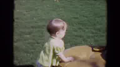 Davis California (1967): A Baby In Garden Is Playing With Toy With Other Kid