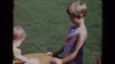 Davis California (1967): Baby Playing Pretend With Other Kids