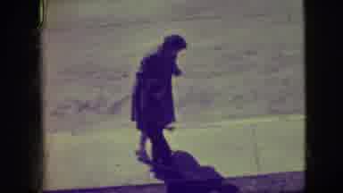 Elmwood Park Illinois (1945): A Mother Helps Her Young Son Balance Himself While