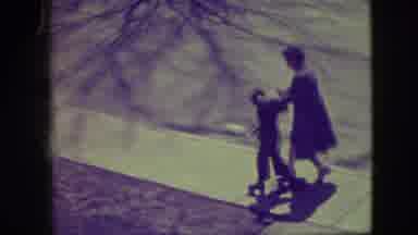 Elmwood Park Illinois (1945): A Lady Is Helping Hold Up A Child Who Is Learning To