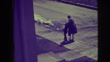 Elmwood Park Illinois (1945): View Of A Child Outside Learning How To Skate On A