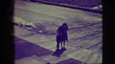 Elmwood Park Illinois (1945): A Lady Helping A Child Learn To Roller Skate Down A