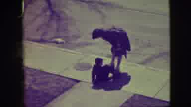 Elmwood Park Illinois (1945): Woman Helping Small Boy Stand After Falling On