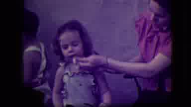 South Haven Michigan (1946): A Woman Wipes The Face Of A Little Girl In A Dress