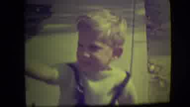 Park Ridge Illinois (1946): Blond Boy In Overalls Sucking A Lollipop And Smiling