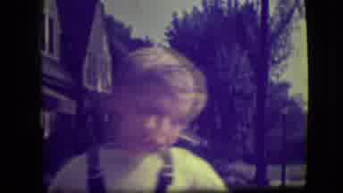 Park Ridge Illinois (1946): Boy Wearing White Shirt Talks To Camera Man On A Sunny