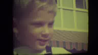 Park Ridge Illinois (1946): A Blond Boy Wearing Overalls Outside On A Sidewalk