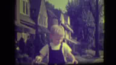 Park Ridge Illinois (1946): A Blonde Haired Boy Wearing Overalls Holds Onto Bike